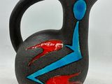 a black vase with a blue and red design on it