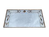 a large rectangular mirror with an ornate design and a gold border