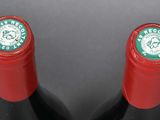 two bottles of wine that are sitting on a table