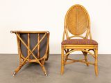 pair of rattan chairs and magazine rack in the shape of a chair