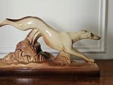 a figurine of a dog and a cat on a table