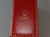a red box with gold writing on it sitting on a table