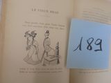 un livre ouvert sur lequel figure le dessin d'une femme et d'un homme