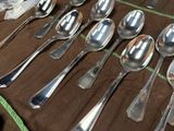 a lot of spoons and spoon spoons on a table