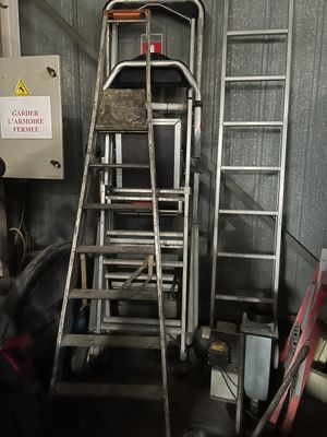 a ladder that is leaning against a wall in a garage
