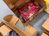 several boxes of assorted items are sitting on the floor