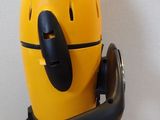 a yellow robot that is sitting on top of a table