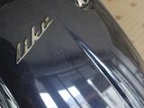 a close up of a motorcycle with a shiny emblem on it