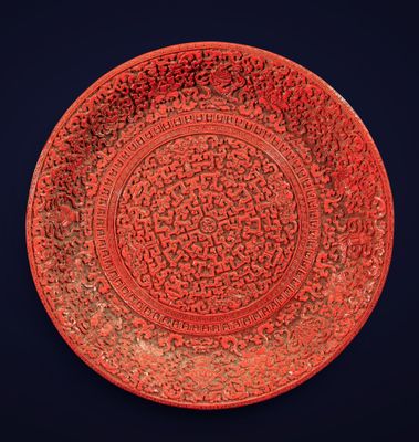 an image of a red plate with a design on it