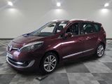 a picture of a burgundy colored car parked in a garage