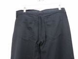 a close up of a pair of black pants on a hanger