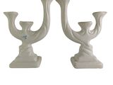 pair of white ceramic candlesticks in the shape of a bird
