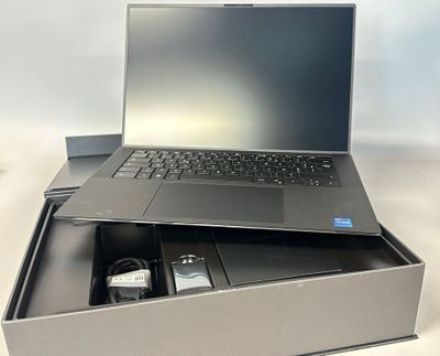 a laptop computer sitting in a box on a table