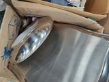 a pile of boxes and a metal pan sitting on a table