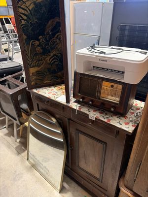 a lot of furniture and appliances on display in a store