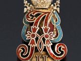 an image of a badge with a crown on top of it