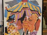 a picture of a picture of a clown and a cat on a table