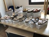 many pairs of shoes sitting on a table in a room