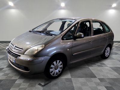 a picture of a silver car parked in a garage