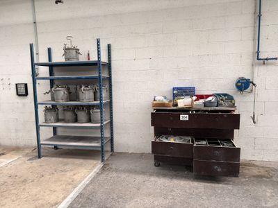 a garage with a lot of shelves and drawers in it