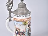 a beer mug with a picture of a horse and rider on it