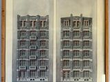 two drawings of a building with a clock on the top and a clock on the bottom of the building