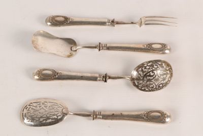 five silver spoons and a fork on a white surface