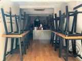 a room with a lot of chairs and tables in it