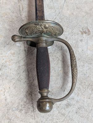 a close up of a sword on a wall