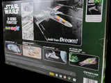 a box with a model of a star wars fighter in it