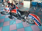a motorcycle with a confederate flag painted on the side of it