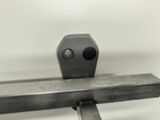 a close up of a metal object on a white surface