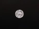 a round brilliant cut diamond on a black background