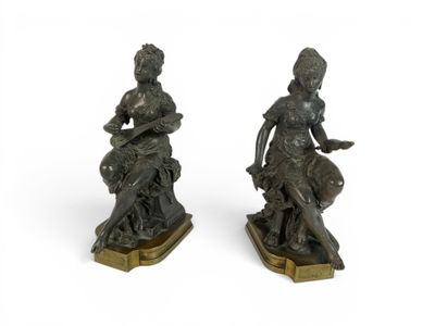 pair of bronze figurines of a woman and a dog