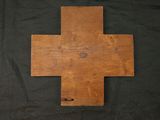 an old wooden cross on a black background