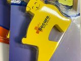 a close up of a yellow plastic toy with a cat on it ' s back