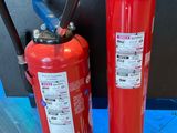 two fire extinguisors next to each other on the floor
