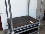 an image of a metal bed frame with a wooden top