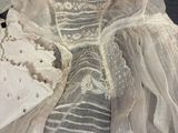 an image of a wedding dress on a bed