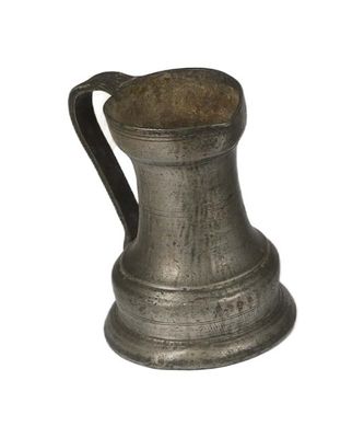 a silver pitcher with a handle on a white background