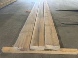 several pieces of wood are stacked on top of each other in a warehouse
