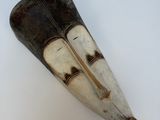 an image of a close up of a wooden object on a white surface