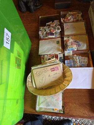 a table with a lot of postcards and a basket with a hat on it