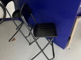 two chairs that are sitting in front of a counter