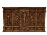 carved wooden crucifix with four figures and a crucifix on the cross