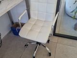 a computer desk with a printer on it and a chair in front of it