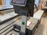 an image of a conveyor belt in a grocery store