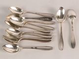 a lot of spoons and spoon spoons on the table