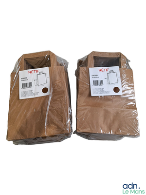two bags of brown clothing sitting on top of a white surface