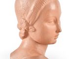 an image of a clay head of a woman on a white background